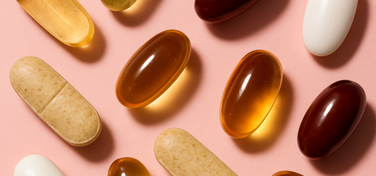 vitamins on pink background