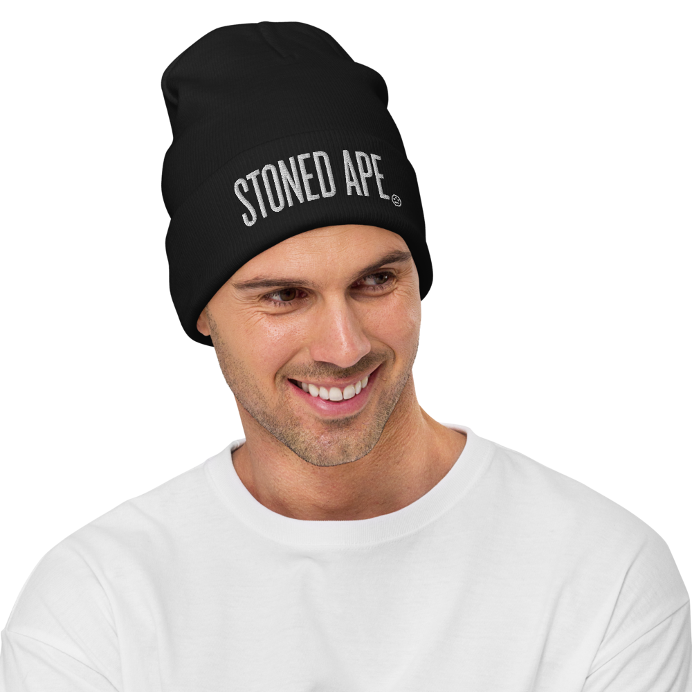 man wearing black stoned ape beanie